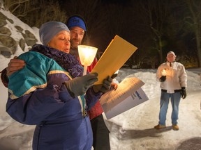 Linda Beland with her son Raymond Beland holds a vigil every year at the Notre Dame des Lourdes Grotto in memory of her son, Douglas Stewart, who died in a brutal home invasion 12 years ago.
