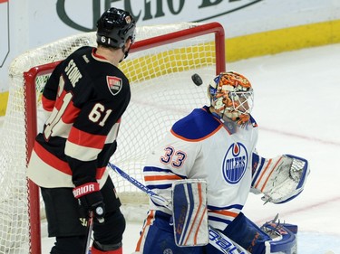 Ottawa Senators' Mark Stone looks on as a goal from teammate Mike Hoffman (not pictured) goes past Edmonton Oilers' Cam Talbot during first period NHL action.