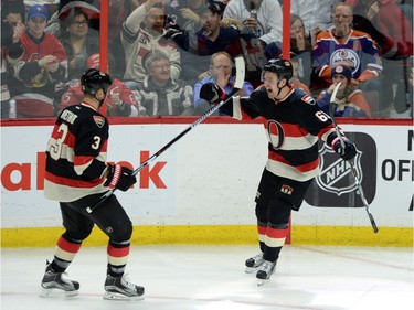 Ottawa Senators' Mark Stone, right, celebrates a second period goal against the Edmonton Oilers with teammate Marc Methot.