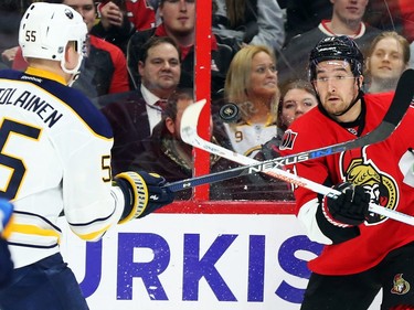 Mark Stone of the Ottawa Senators battles against Rasmus Ristolainen of the Buffalo Sabres during first period NHL action.