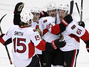 Ottawa Senators' Mark Stone (61) celebrates with teammates after his goal during the first period.