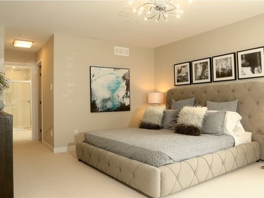 The master bedroom, with its double walk-in closets and generous ensuite, stretches across the back of the home.