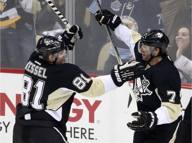 Pittsburgh Penguins' Matt Cullen (7) celebrates his goal with teammate Chris Kunitz (14) during the first period.