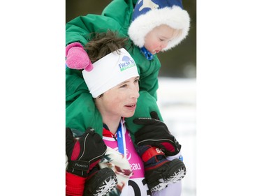 Megan McTavish with two-year-old daughter Leena Saidla at the finish line of the 27km Classique.