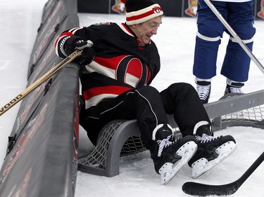 Rick Smith takes a tumble into the net.