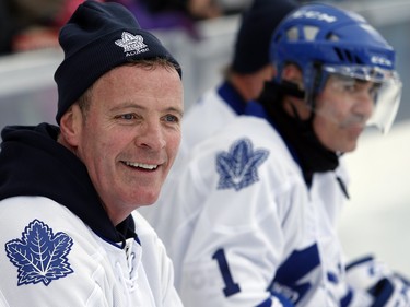 Leafs alumnus Tom Fergus sits on the bench and watches the game.
