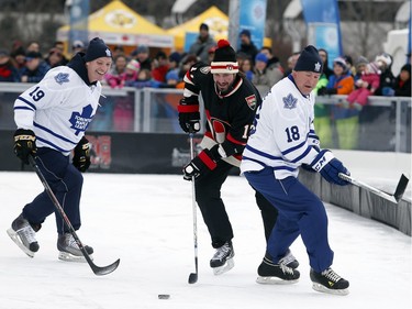 Denis Hamel gets the puck away from two Leafs alumni.