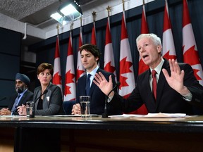 Global Affairs Minister Stéphane Dion discusses Canada's renewed mission against ISIL during a press conference Monday.