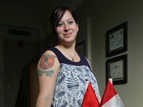 MP Christine Moore poses for a photo in her office on Parliament Hill in Ottawa Ontario Thursday Jan 21, 2016.