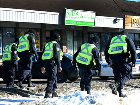 Ottawa police search for evidence near Shifa Restaurant in Ottawa Monday.