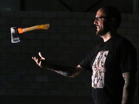 Matt Wilson of BATL Alternative Sports spins one of the axes that are used in the sport of axe throwing.