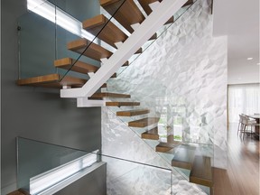 A textured wall like this one by Design First Interiors using Crush wall tiles by Modular Arts creates a great effect in the stairwell of a Westboro home.