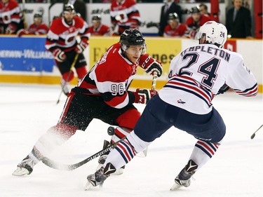 Ottawa 67s' Dante Salituro (96) turns Oshawa Generals' Stephen Templeton (24) inside out with some fancy puck work during the first period.