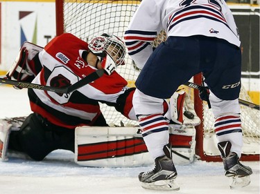 Ottawa 67s' goalie Leo Lazarev makes a big glove save on the Oshawa Generals' Kenny Huether during the second period.