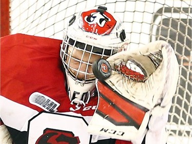 Ottawa 67s' goalie, Leo Lazarev (37) makes a big save against the Oshawa Generals during the second period.
