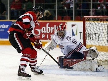 Ottawa 67s' Travis Barron (19) nearly beats Oshawa Generals' goaile, Jeremy Brodeur (56) during the first period.