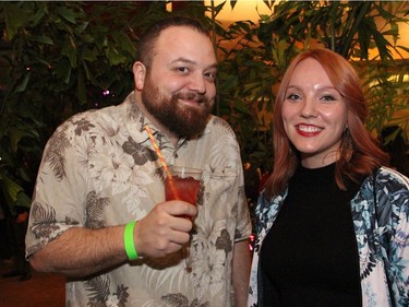 Ottawa artist Marc Adornato in a tropical shirt, seen with Sanna Kirssi at On the  Rocks: In the Caribbean, an annual Winterlude party hosted by the Ottawa Art Gallery at City Hall on Friday, February 5, 2016. (Caroline Phillips / Ottawa Citizen)