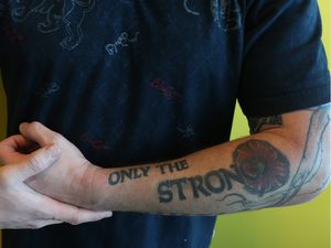 Ottawa city councillor Jody Mitic poses for a photo showing his tattoos at City Hall in Ottawa Wednesday Jan 13, 2016. Tony Caldwell/Ottawa Sun/Postmedia Network