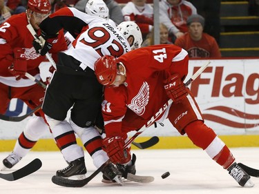Ottawa Senators center Mika Zibanejad (93) and Detroit Red Wings center Luke Glendening (41) battle for the puck in the first period.