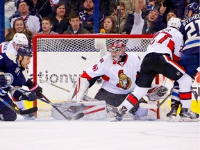 Senators goalie Craig Anderson blocks a shot  during the first period on Saturday, Feb. 13, 2016 at Nationwide Arena in Columbus.