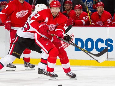 Pavel Datsyuk #13 of the Detroit Red Wings skates up ice with the puck.