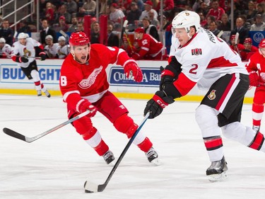 Dion Phaneuf #2 of the Ottawa Senators controls the puck in front of Justin Abdelkader #8 of the Detroit Red Wings.