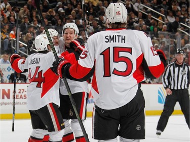 Mark Stone #61 of the Ottawa Senators celebrates his goal with teammates during the first period.