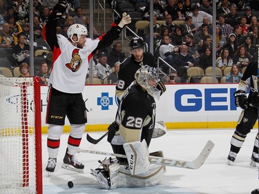 Zack Smith #15 of the Ottawa Senators celebrates a goal by Chris Wideman #45.