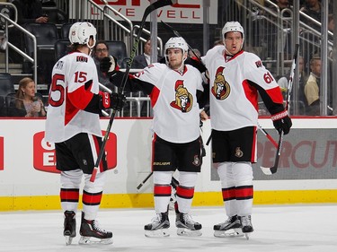 Chris Wideman #45 celebrates his goal with Zack Smith #15 and Mark Stone #61 of the Ottawa Senators during the first period.