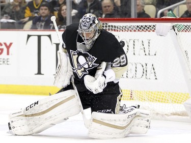 Marc-Andre Fleury #29 of the Pittsburgh Penguins has a shot trickle through resulting in a goal by Jean-Gabriel Pageau of the Ottawa Senators in the second period.