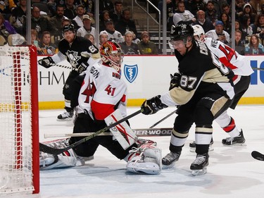 Sidney Crosby #87 of the Pittsburgh Penguins shoots and scores past Craig Anderson #41 of the Ottawa Senators.