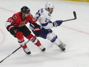 Senator Erik Karlsson races to slow down the Lightning’s J.T. Brown during first period action.