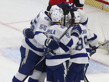 The Lightning’s J.T. Brown celebrates his first-period goal with teammates.