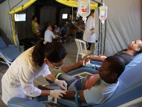 Patients receive treatment at a medical mobile unit in Brasilia, Brazil. The medical unit is in place to help those affected by diseases transmitted by the Aedes aegypti mosquito, such as dengue, malaria and Zika.