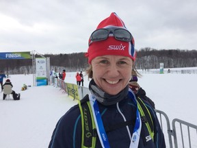 Anne Kari Hansen Ovind, Norway's ambassador to Canada, poses at the finish line after completing the 51-km classic race in the 38th annual Gatineau Loppet.