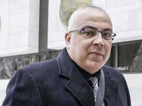 Roland Eid, right, walks to the Ottawa courthouse on Feb.  29, 2016.