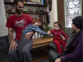 Syrian refugee Mbder Al Abdullah, with Hala, 5, and Saleh, 14 months, and mom Lama. The family is staying temporarily with a family in the Glebe.