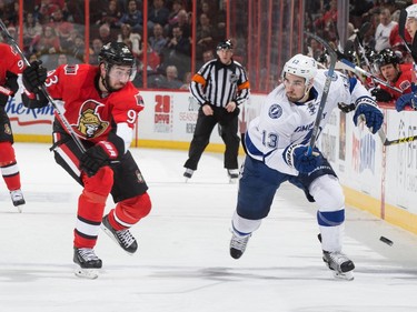 Mika Zibanejad #93 of the Ottawa Senators chases down Cedric Paquette #13 of the Tampa Bay Lightning as he crosses the blue line with the puck.