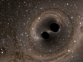 The collision of two black holes holes - a tremendously powerful event detected for the first time ever by the Laser Interferometer Gravitational-Wave Observatory, or LIGO - is seen in this still image from a computer simulation released in Washington February 11, 2016.