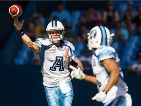 Trevor Harris throws a pass against the RedBlacks during the first half of a CFL game at Toronto on Aug. 23, 2015.