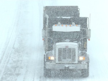 Trucks take a single lane down Highway #416. At times, the northbound lanes were completely whited out from the heavy-falling snow.