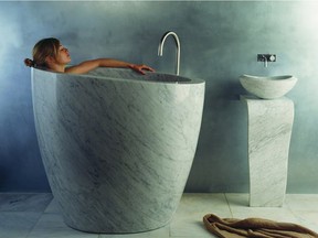 Luxurious tubs come in all shapes, sizes and designs, like this granite bath by Stone Forest.