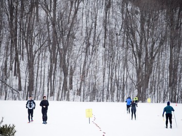 Two snowshoers make their way along the route the cross-country skiers racing in the 27 km Classique during the Gatineau Loppet that took place Saturday February 27, 2016.