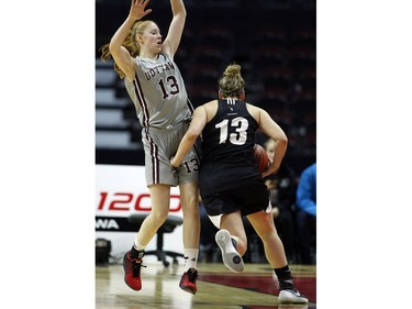 uOttawa Gee-Gees' Catherine Traer, left, can't stop Carleton University Ravens' Nicole Gilmore, right.
