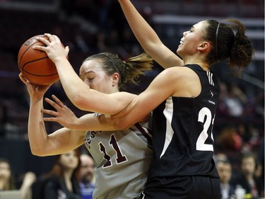 uOttawa Gee-Gees' Kellie Ring, 11, is guarded by Carleton University Ravens' Elizabeth Leblanc, left.