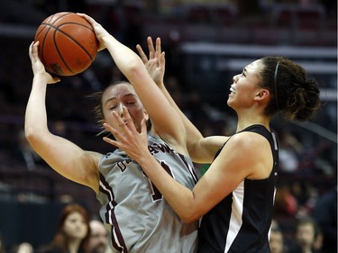 uOttawa Gee-Gees' Kellie Ring, 11, is guarded by Carleton University Ravens' Elizabeth Leblanc, left.