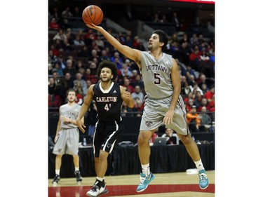 uOttawa Gee-Gees' Mehdi Tihani, 5, lays it up.