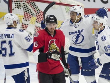Ottawa Senators defenceman Patrick Wiercioch (46) skates past Tampa Bay Lightning right wing J.T. Brown, second from right, as he celebrates his first period goal with teammates Nikita Nesterov, right, and Valtteri Filppula during first period NHL action.