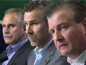 Vancouver Canucks general manager Jim Benning, right to left, President of Hockey Operations Trevor Linden and Head Coach Willie Desjardins.