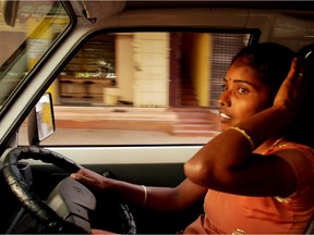 Selvi behind the wheel in a scene from the film 
Driving with Selvi.